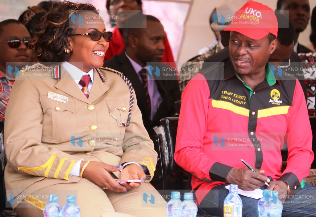 Embu County Commissioner Esther Maina chats with Embu Senator Lenny Kivuti