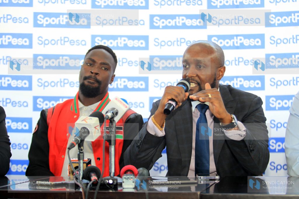 Sportpesa Chief Executive Officer Ronald Karauri with Kenya Rugby Union Shujaa Captain Nelson Oyoo