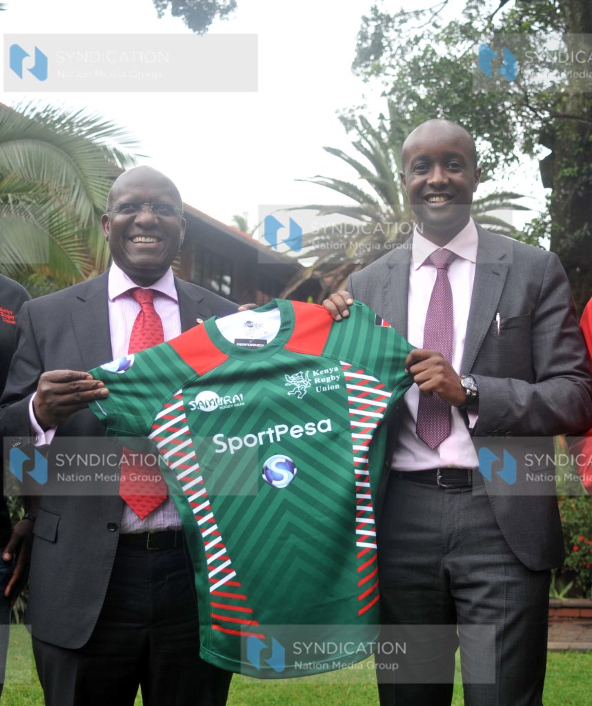 Sportpesa Ronald Karauri with Kenya Rugby Union chairman Richard Omwela