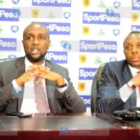 Sportpesa Chief Executive Officer Ronald Karauri with Sports Permanent Secretary Nderitu Kaberia