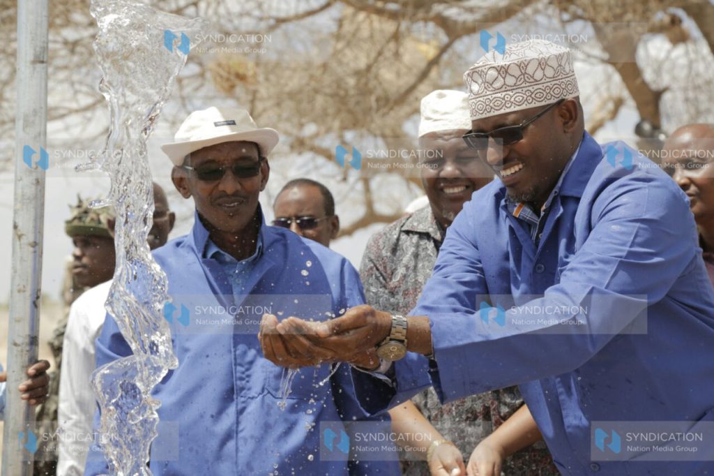 Wajir Governor Ahmed Abdullahi (right) with water chief officer Abdinoor Hussein in Dadajabula