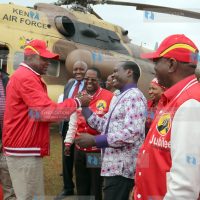 President Uhuru Kenyatta is received by Embu Senator Lenny Kivuti at King David High School, Kamama, before addressing a rally