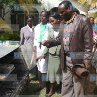 Siakago MP Lenny Kivuti is taken around a demonstration bakery during an exhibition by a women's group