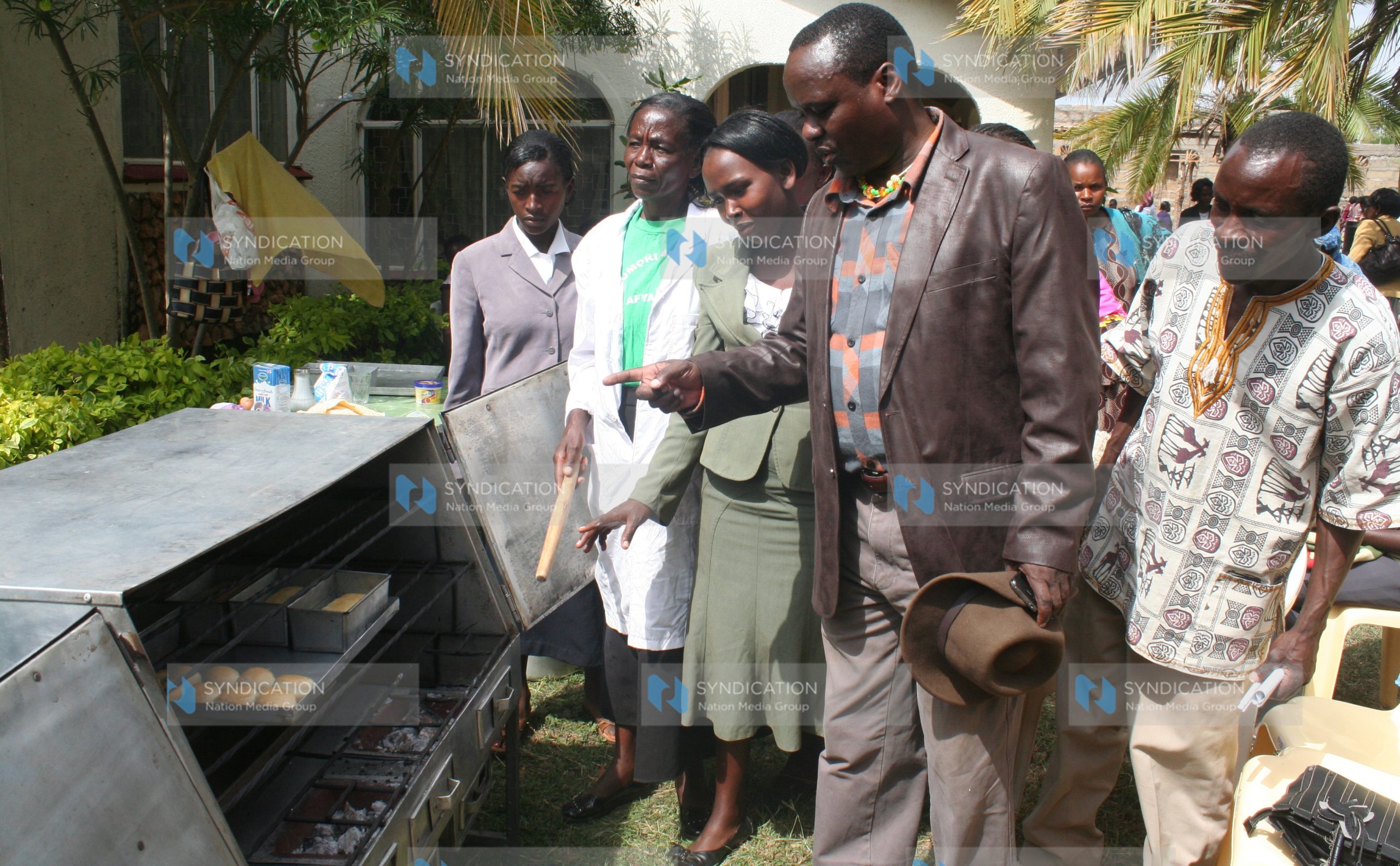 Siakago MP Lenny Kivuti is taken around a demonstration bakery during an exhibition by a women’s group