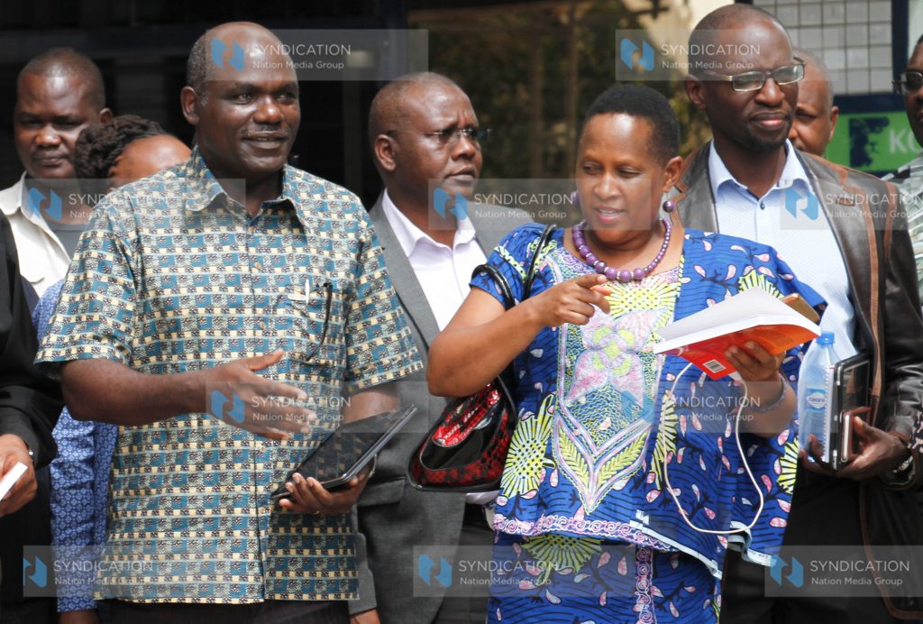 IEBC Chairman Wafula Chebukati with Judy Pareno of ODM and Andrew Msengi of Jubilee Party