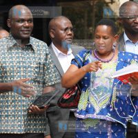 IEBC Chairman Wafula Chebukati with Judy Pareno of ODM and Andrew Msengi of Jubilee Party