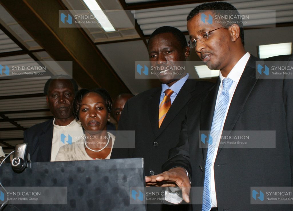 The Interim Independent Electoral Commission chairman Ahmed Issack Hassan (right)