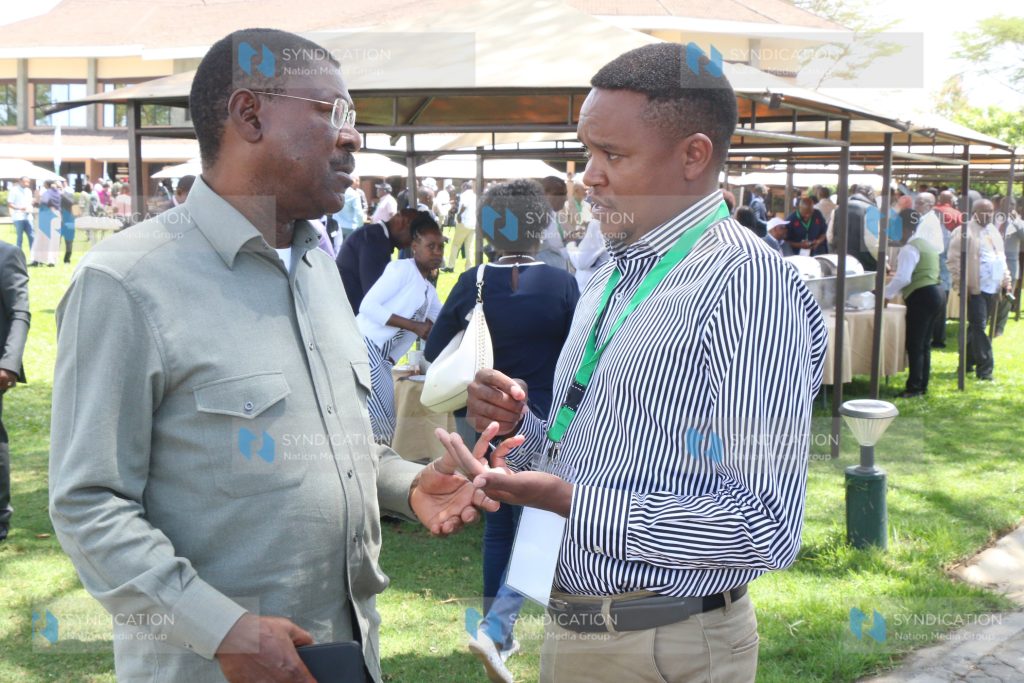 Speaker of the National Assembly Moses Wetang'ula converses with MP for Molo Kuria