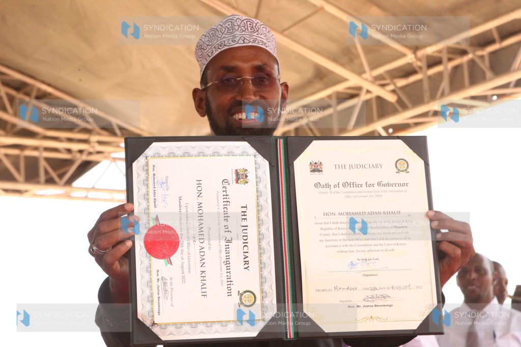 Mohamed Adan Khalif displays a certificate