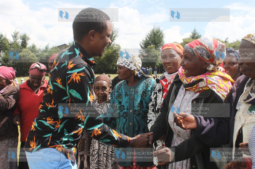 Molo MP Kuria Kimani is received by the elderly at DEB Primary School