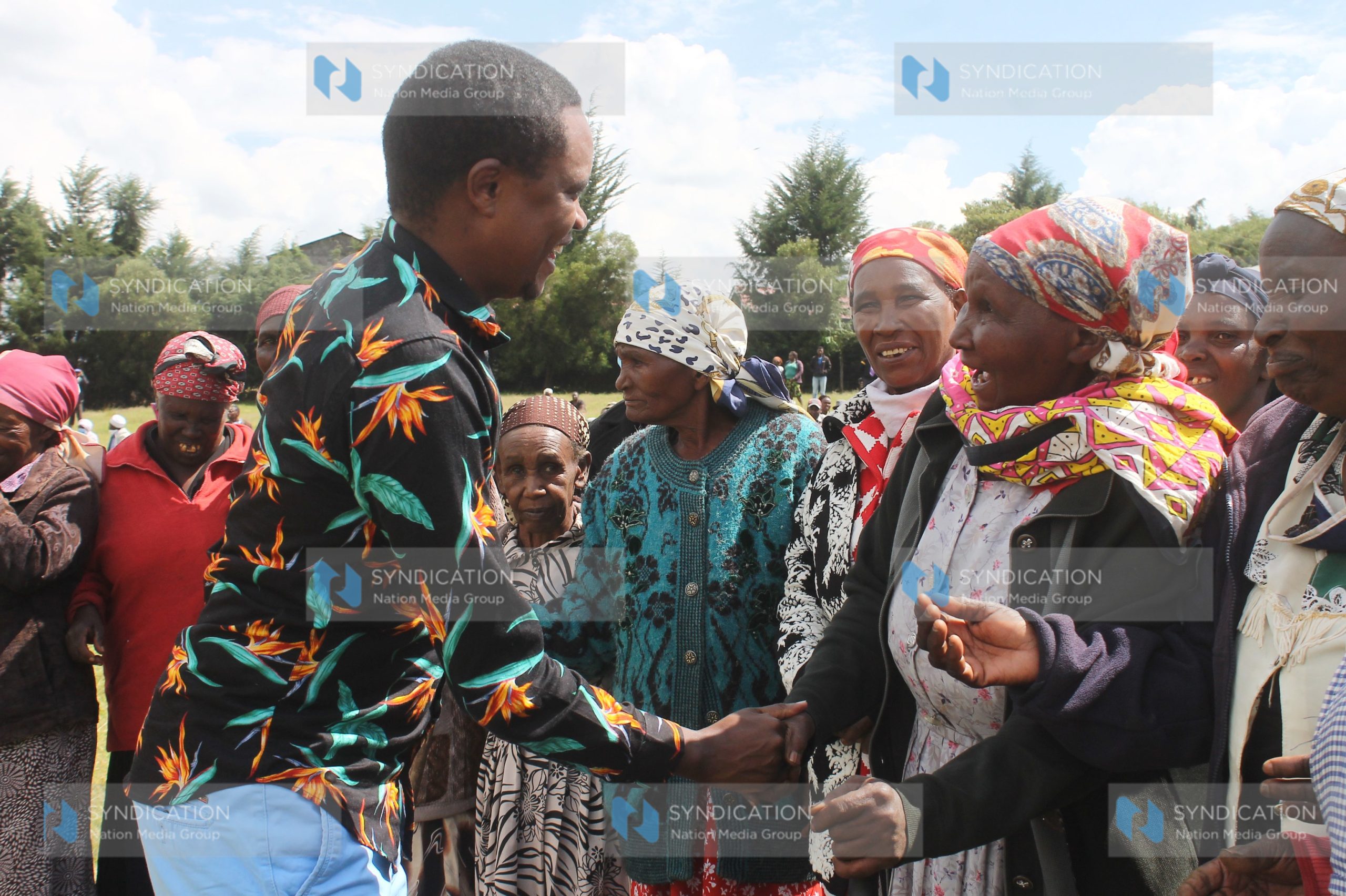 Molo MP Kuria Kimani is received by the elderly at DEB Primary School