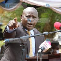 Nyeri Governor Mutahi Kahiga makes his speech during food donation drive to widows outside his office