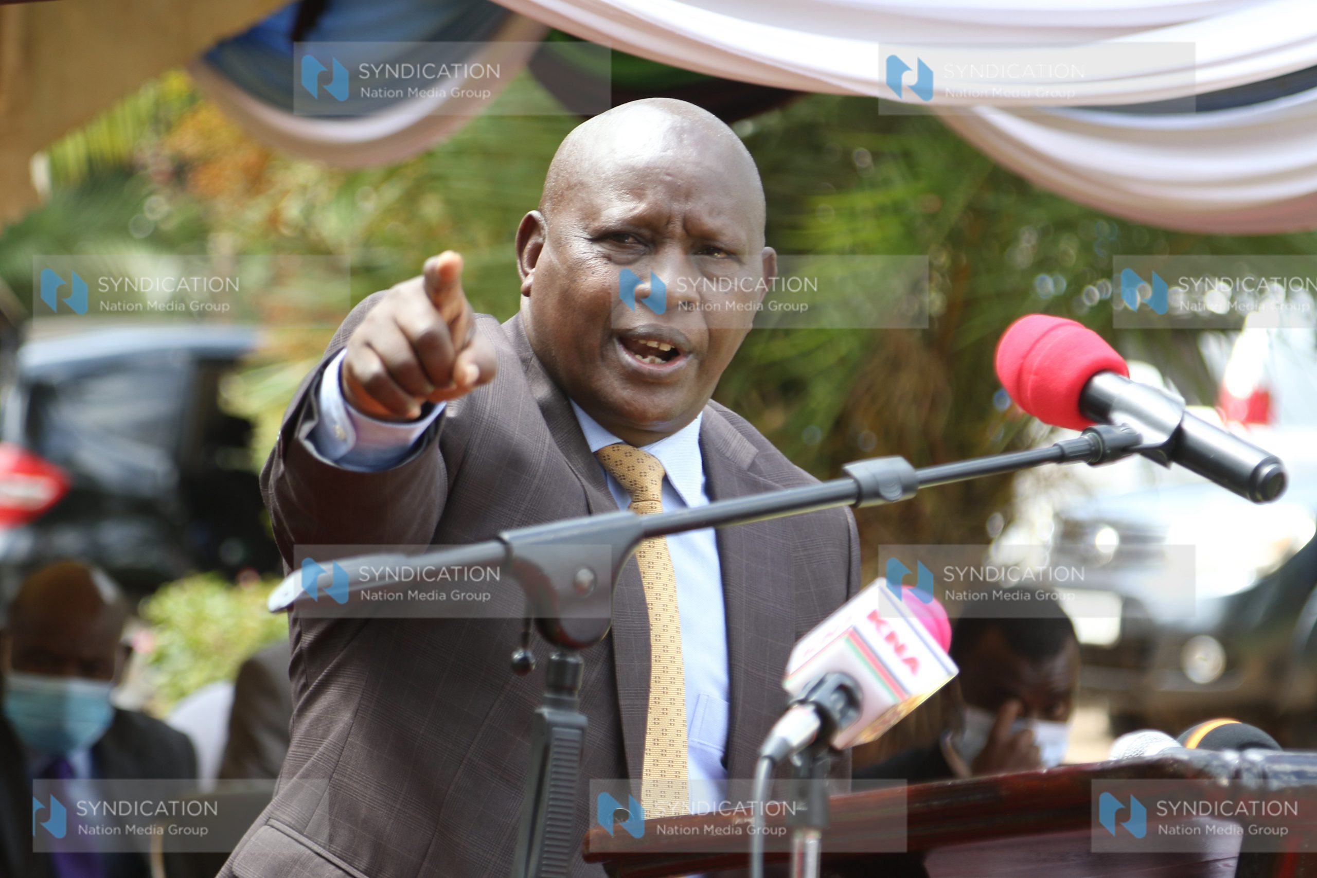 Nyeri Governor Mutahi Kahiga makes his speech during food donation drive to widows outside his office
