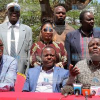 Former Embu Senator Lenny Kivuti (right) addresses the press