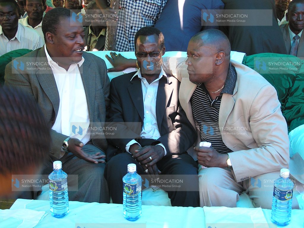 Lugari MP Cyrus Jirongo (left) and Assistant Minister Wakoli Bifwoli (centre) confer with former Budalang'i MP Raphael Wanjala