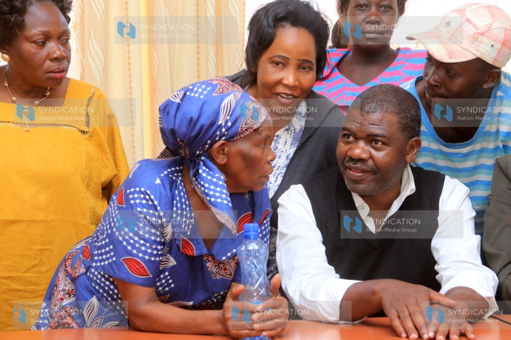 Ruaraka MP Tom Kajwang having a word with some of his supporters at Ngong law courts
